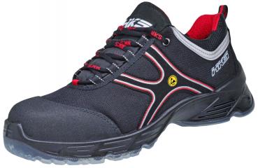 The shoe is a safety shoe made of black material. It features multiple practical Velcro fasteners, a reinforced toe cap, and a non-slip sole. Ideal for work.