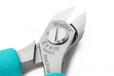 The image displays a small pair of pliers with sharp blades. It features a silver body and grippy, turquoise handles. The brand inscriptions Weller and Erem are visible on the pliers.
