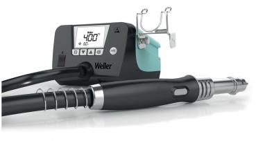 The image displays a soldering iron kit. It includes a digital control unit with a display and controls. Attached to a hose is the soldering tip.