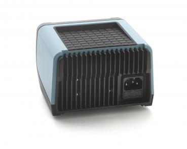 The image depicts a compact, square device with a smooth, blue top and a ridged back. A socket is visible on the bottom. It appears modern and functional.