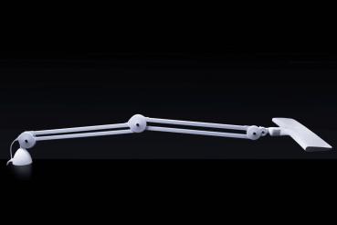 In the picture, there is a flexible, white desk lamp with a long arm and a rectangular lampshade. It rests on a round base. The background is black.