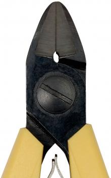 The image shows a pair of pliers with narrow, pointed jaws. The handles are beige and the blades are made of black metal. There is a circular indentation in the middle.