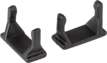Das Bild zeigt zwei kleine, schwarze Kunststoffteile. Sie haben eine rechteckige Basis mit zwei aufrechten Stützen, die sich leicht nach oben neigen. Ideal für Halterungen oder Befestigungen.