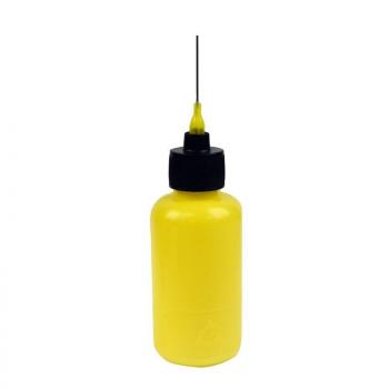 The image shows a yellow bottle with a narrow, long tip and a black lid. The bottle could be used for ketchup, mustard, or another liquid.