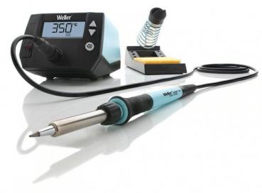 The image displays a soldering iron kit. It includes a digital temperature controller with a display, a soldering iron, and a stand with a sponge. The iron has a black handle and is silver-colored.