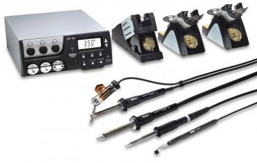 The image displays a soldering station with a digital display and multiple controls. Included are various soldering tools and holders with bronze-colored sponges for cleaning.