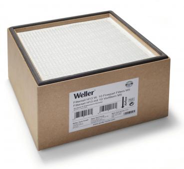 The image shows a square box made of cardboard-like material. A filter with a structured surface is visible on top. On the side, there is a label with technical information.