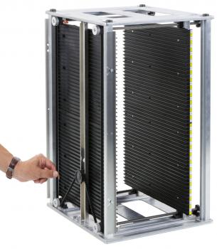 The image shows a square, open metal device with movable black plates. A hand reaches from one side to move the plates. It appears to be a module for light or air regulation.