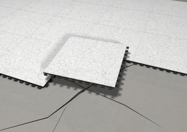 The image shows a floor covering made of light, marbled tiles. One tile is slightly shifted and placed over a crack in the substrate. The substrate is gray.