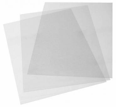 In the image, multiple transparent, rectangular plastic films are stacked on top of each other. They are colorless and appear slightly curved. The films vary in size.