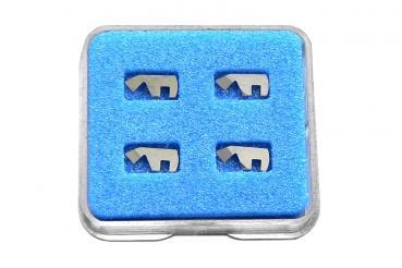 On a blue background, there are four metallic elements that look like small letters or symbols. They are arranged and display a clear, simple shape.