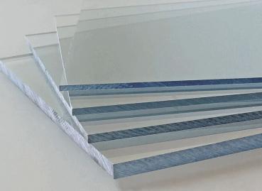 In the picture, several glass panes are stacked on top of each other. They are clear and reflect light, giving them a glassy, cool appearance. The edges are sharp.