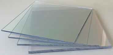 The image shows multiple transparent glass panes stacked on top of each other. The edges are slightly frosted, and they vary in size, arranged at a slight angle.