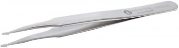 The image shows a silver tweezer. It has a long, narrow shape with a slightly curved tip and a logo-like inscription on the side. The surface is smooth.