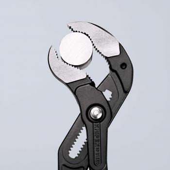 The image displays pliers with a round, smooth metal surface in the center. The plier handles are black and the pliers have serrated edges for better grip.