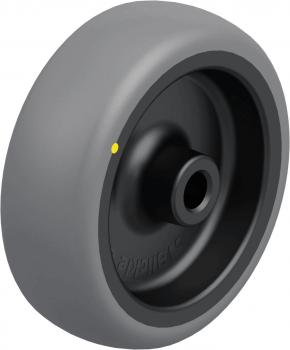 The image shows a gray wheel with a round, flat profile and a black core. On the outer side, there is a yellow dot. The wheel has a diameter of about 20 cm.
