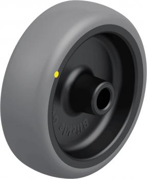 The image shows a gray wheel with a black interior. It has a smooth surface and a hole in the center. Additionally, there is a small yellow dot on the outer surface.
