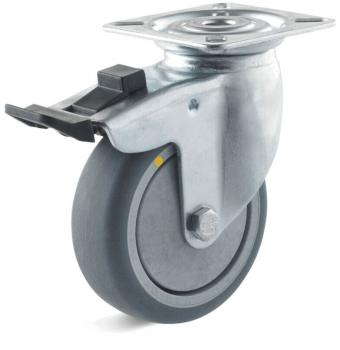 The image displays a single caster wheel. It features a metallic bracket with a round, gray rubber tire. On the side, there is a brake mechanism.