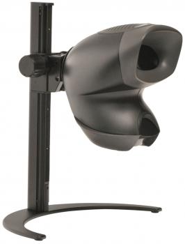 The image shows a black, technical device with two round openings on the front, mounted on a sturdy base. It has a smooth, ergonomic shape.
