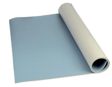 The image displays a piece of blue plastic in a roll form. A part of the roll is unrolled and laid flat on a surface. The color is uniform and matte.