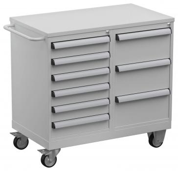 The image shows a gray tool cart on wheels with a work surface on top. It has five drawers on the left side and two drawers on the right side with long handles.