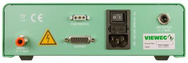 The image shows the back of a green device. It has various connections: for air supply, a foot switch, an I/O port, and a power connection. A safety sign is also visible.