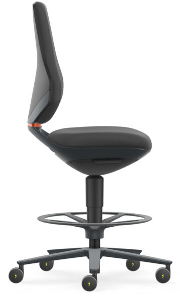 The office chair is black with an ergonomic backrest and seat. It has a central stand and five rolling legs with yellow wheels. A foot ring is present.