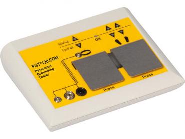 The image shows a yellow testing device with two large metal plates in the center. It has buttons and symbols, including 