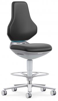 The chair has a black, ergonomically shaped backrest and seat. It stands on a silver base with a wide, round base and casters, ideal for mobility.