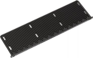 The image shows an elongated, black object with several parallel grooves on the surface. The grooves are evenly arranged and provide a textured texture.