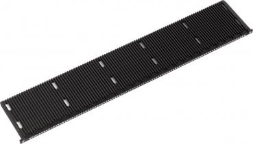 The image shows a long, flat black component with parallel grooves, which has small cutouts on one side. It appears to be a part of a technical device or a circuit board.
