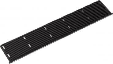 The image shows a long, narrow, black plastic strip with many fine grooves. It has several openings along the edges and is commonly used in technical devices.