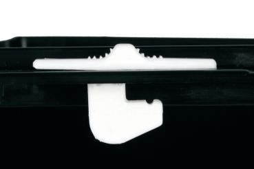 The image shows a black plastic container with a white closure mechanism. The closure has a curved shape and a straight edge.
