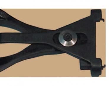 The image shows a black tool with two long, curved handles connected to a sturdy plate with a round metal axis. It has a central opening.