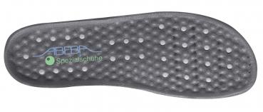 The image displays the underside of a special shoe sole. It is black with many small, round indentations and the inscription "ABEAR Special Shoes" in green. The surface appears to be slip-resistant.