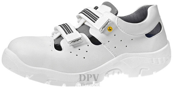 The image shows a white shoe with open sides and a padded lining. It has two attached Velcro straps and ventilation holes.