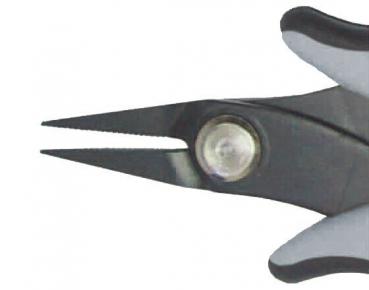 The image shows the tip of a pair of scissors. The handles are gray and black, and the blade is narrow and pointed. A screw head is visible in the center.