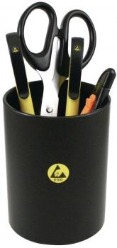 A black pen holder is on a table. It contains yellow and black scissors, a yellow marker, and other writing utensils. The container has a yellow logo.