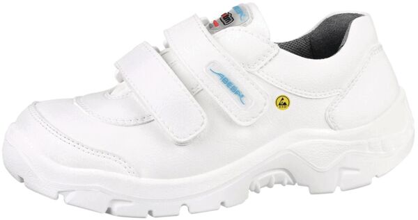 Der Schuh ist weiß, mit breitem, gepolstertem Rand und zwei Klettverschlüssen. Die Sohle ist robust mit grobem Profil, ideal für sicheren Halt und Komfort.