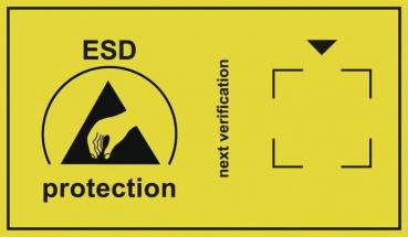 The image shows a yellow sign with a symbol for ESD protection (a hand touching an arrow). Next to it is "next inspection" with an arrow pointing downward.