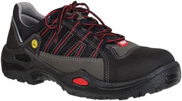 The image shows a sturdy work shoe. It is primarily black with gray and red design elements. The laces are red, and the shoe has a non-slip sole.