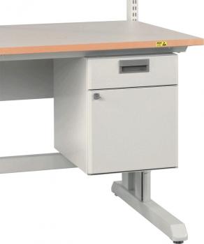 The image shows a desk with a light wooden top and a gray base. On the left side, there is a drawer unit with a small drawer and a door.