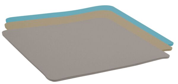 The image displays a flat, rectangular mat surface with rounded corners. The color is a uniform, light beige. The mat appears soft and flexible.