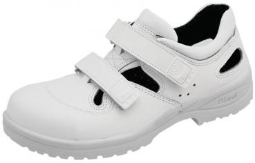 Der Schuh ist weiß und hat zwei praktische Klettverschlüsse. Er hat eine sportliche Form mit kleinen Lüftungsschlitzen an der Seite und einer rutschfesten Sohle.