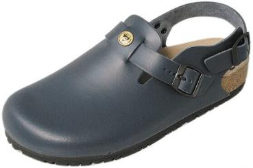 The image shows a black clog shoe. It has a closed front, a wide heel, and an adjustable strap at the back. The sole is sturdy and made of a dark material.