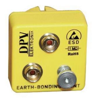 The image shows a yellow electronic device with two round sockets and a screw. It is used for grounding and has the labels "DPV Elektronik" and "ESD".