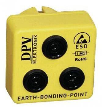 The image shows a yellow, square plug with three round, black connectors. On the top are the inscriptions "DPV", "ESD", "RoHS", and "EARTH-BONDING-POINT".