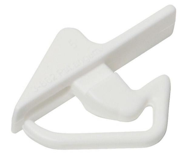 The image shows a small, white plastic hook in the shape of a simple device. It has a triangular tip and a loop resembling a clip, likely used for attaching or hanging.