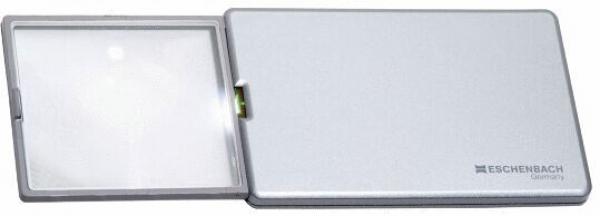 The image shows a practical magnifying glass in a compact, silver casing. The magnifying glass is foldable and has a clear, magnifying lens. It is suitable for better visibility of small text.