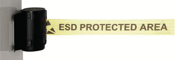 The image displays a yellow barrier tape marked "ESD PROTECTED AREA". It is attached to a black holder. The tape indicates an area that is protected against electrostatic discharge.